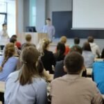 depositphotos_182969748-stock-video-group-of-university-students-sitting